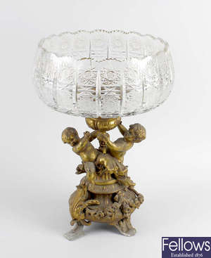 A gilt spelter and cut glass table centre piece.  