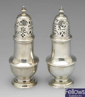 A pair of George II silver casters, etc.