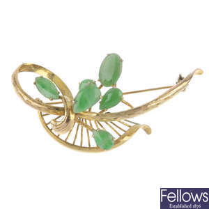 A jade floral brooch.