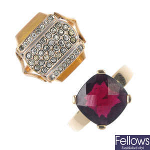 A garnet ring and a plated ring watch.