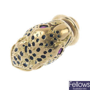 A ruby and enamel leopard ring.