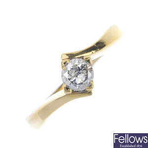 A diamond single-stone crossover ring.
