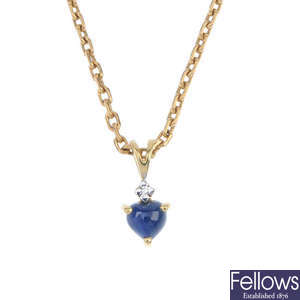 Two diamond and gem-set heart pendants.