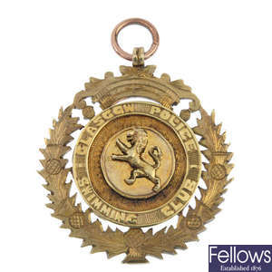 A 1930s 9ct gold Glasgow Police swimming medal.