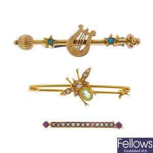 A selection of three bar brooches.