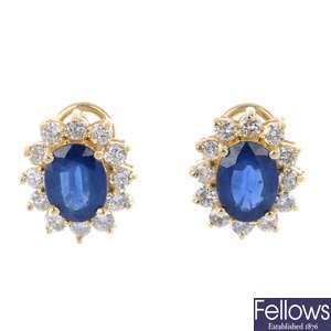 A pair sapphire and diamond cluster ear studs.