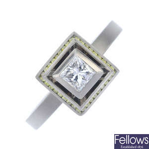 A platinum diamond and colour treated 'yellow' diamond dress ring.