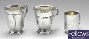 Three early 20th century silver christening mugs.