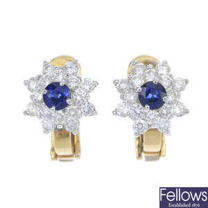 A pair of diamond and sapphire cluster ear studs.