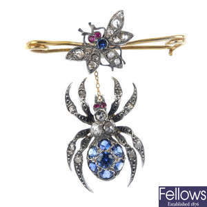 A diamond sapphire and ruby spider and fly bar brooch. 