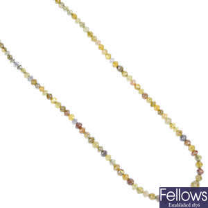 A graduated diamond bead single-strand necklace. 