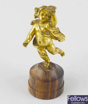A late 18th/early 19th century cast gilt bronze (ormolu) figure of Bacchus. 