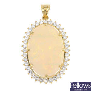An 18ct gold opal and diamond cluster pendant. 