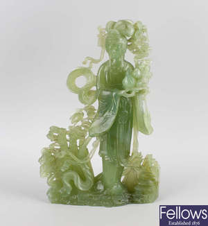 A large Chinese carved nephrite jade figure. 