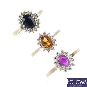 A selection of five gem-set rings.