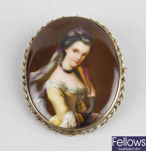 A late 19th/early 20th century painted porcelain brooch.