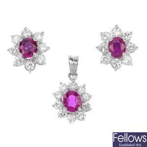 A ruby and diamond cluster pendant and ear stud set. 
