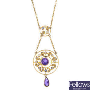 An early 20th century gold amethyst and split pearl pendant.