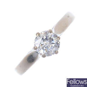 A white gold diamond single-stone ring.