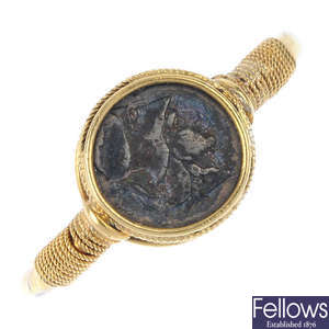A 22ct gold ring, set with an Ancient Greek obol coin.