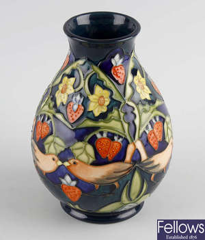 A Moorcroft 'Strawberry Pickers' vase. 