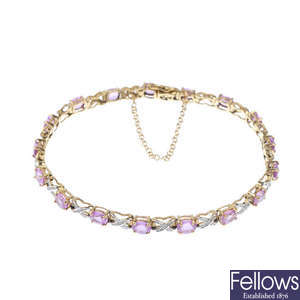 A 9ct gold pink sapphire and diamond line bracelet. 