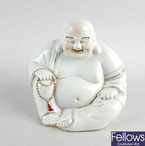 A 20th century Chinese porcelain figure of Hotei / Budai. 