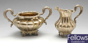 An early Victorian Irish silver twin-handled sugar basin and matching cream jug.