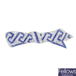 A sapphire and diamond bow brooch. 