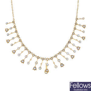 An early 20th century gold seed pearl fringe necklace. 