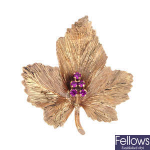 A synthetic ruby maple leaf brooch and a pair of ear studs.