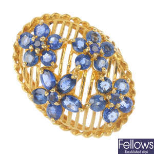 An 18ct gold sapphire floral ring.
