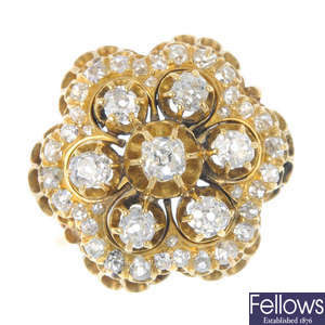 A mid 20th century gold diamond floral cluster ring. 