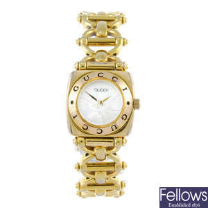 GUCCI - a lady's gold plated 6400L bracelet watch.