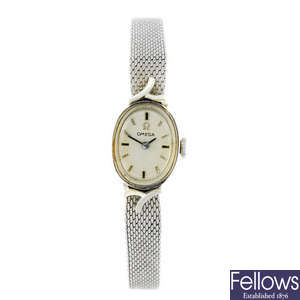 OMEGA - a lady's white metal bracelet watch.