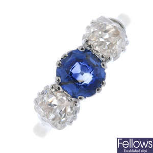 A mid 20th century 18ct gold and platinum sapphire and diamond three-stone ring. 