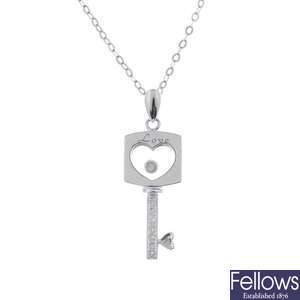 A diamond key pendant.