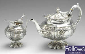 An Edwardian silver teapot and milk jug. 
