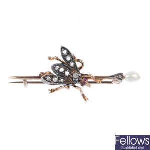 A late 19th century silver and gold diamond, ruby and cultured pearl fly bar brooch. 