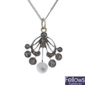 A cultured pearl and diamond pendant.