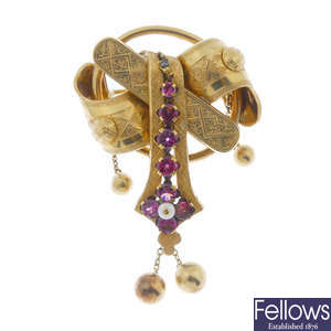 A late 19th century gold, garnet and seed pearl brooch.