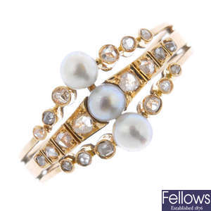 A pearl and diamond ring.