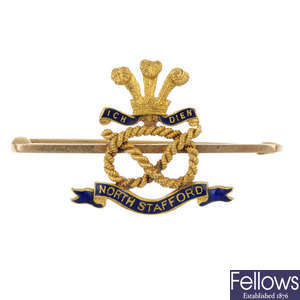 An early 20th century 15ct gold enamel regimental brooch.