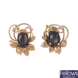 A pair of star sapphire floral earrings. 