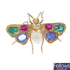 An early 20th century gold diamond and gem-set butterfly brooch.