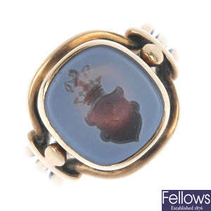 An early 20th century gold hardstone intaglio signet ring.