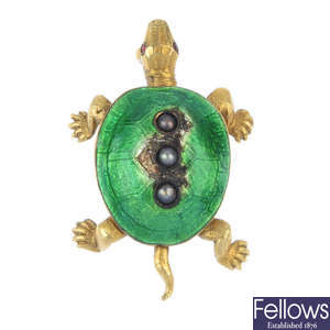 An enamel and gem-set turtle brooch.