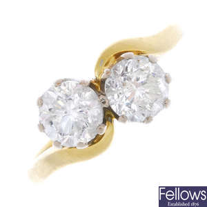 An 18ct gold diamond two-stone crossover ring.