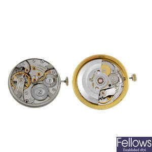 LONGINES - a group of eight watch movements with dials.