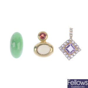 Two gem-set pendant and a loose jade cabochon.  